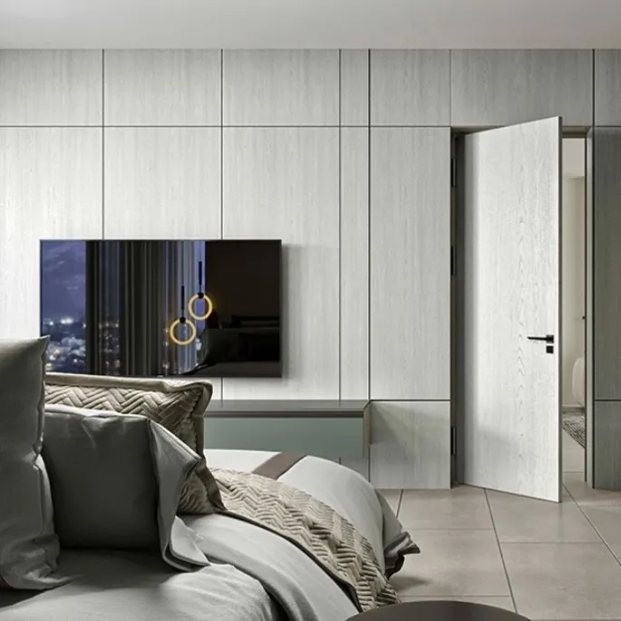 70-inch black prop TV displayed in a staged bedroom interior