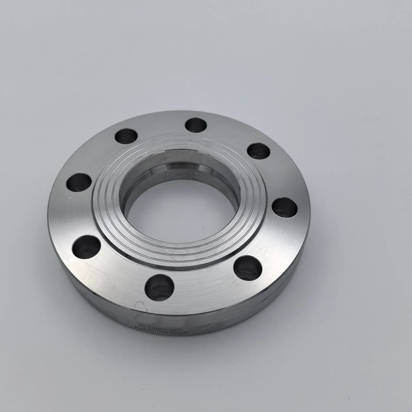 Slip-on flange with bolt holes, raised face