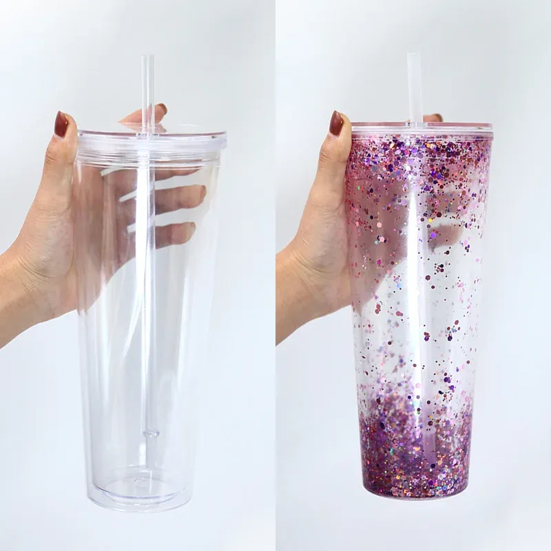 Clear and purple glitter double-wall 24oz plastic straw tumblers held in hands