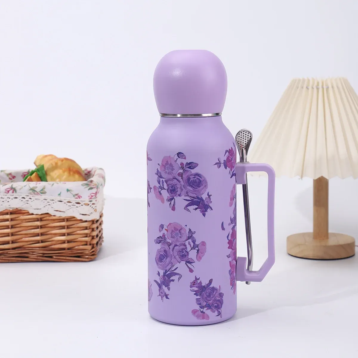 Purple rose floral 1300ml vacuum bottle with purple dome lid, side handle and metal filter-spoon straw, lifestyle view