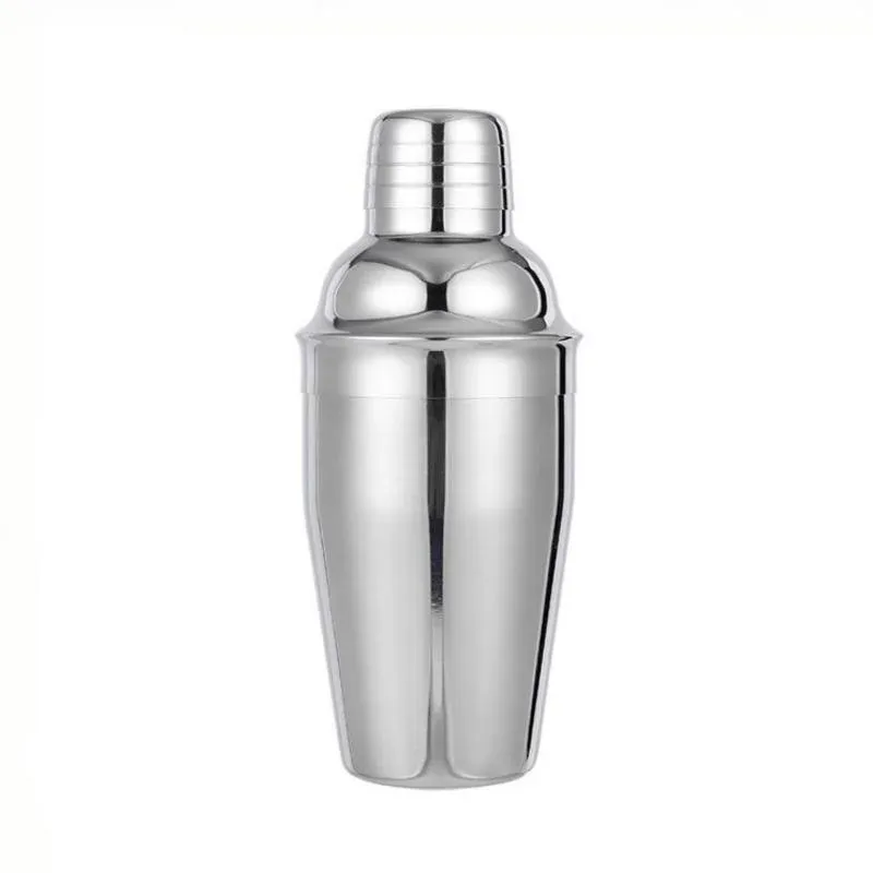 Silver three-piece stainless steel cocktail shaker standing upright on a white background