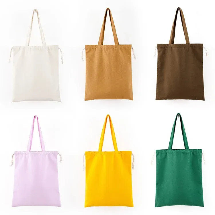 Color options grid of six canvas drawstring totes in natural, mustard, brown, pink, yellow and green