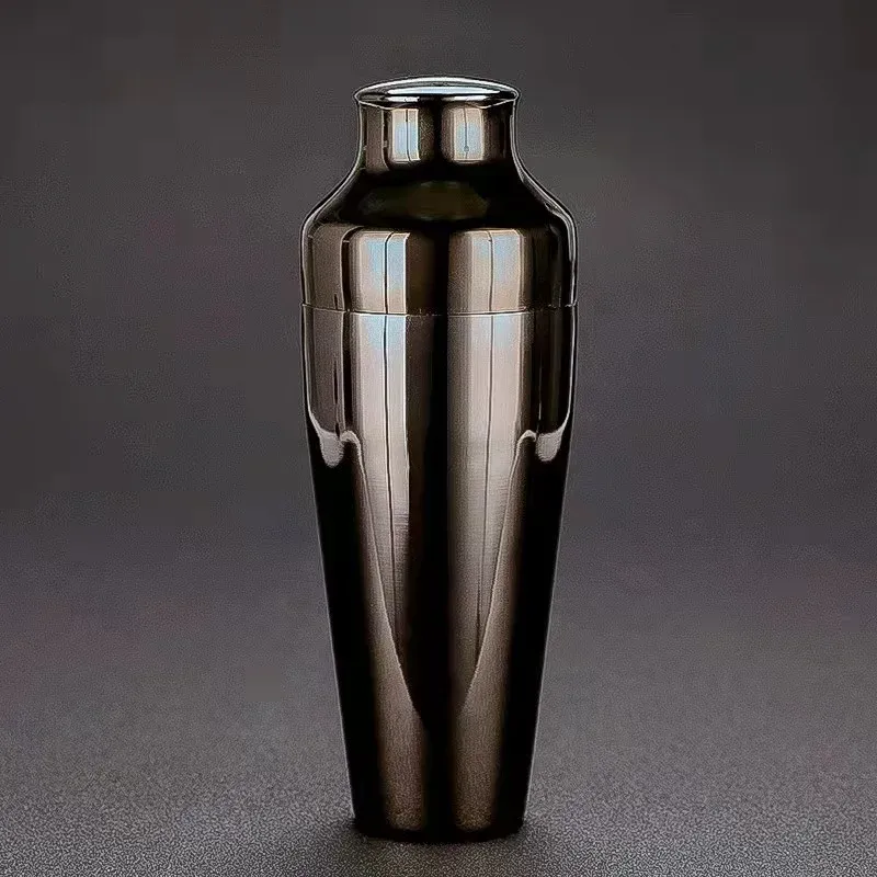 Glossy black stainless steel cocktail shaker on a dark grey background