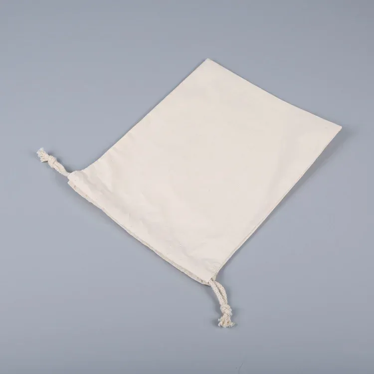 Flat natural canvas drawstring pouch lying at an angle showing the drawstring channel