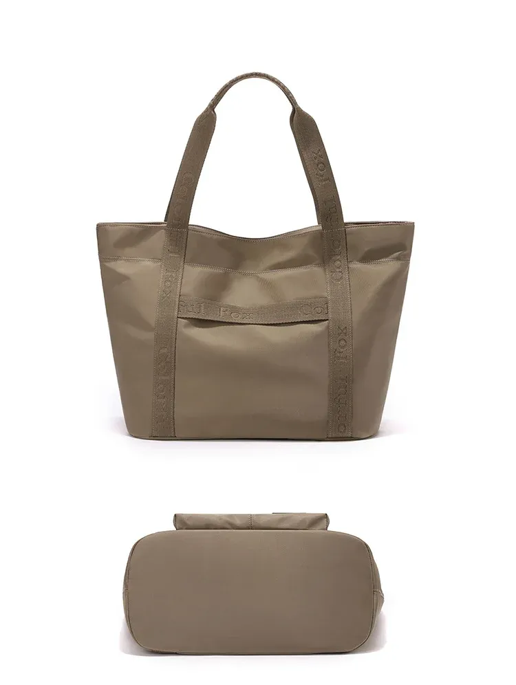 Khaki nylon tote bag shown from the front and from the reinforced base, with printed webbing handles