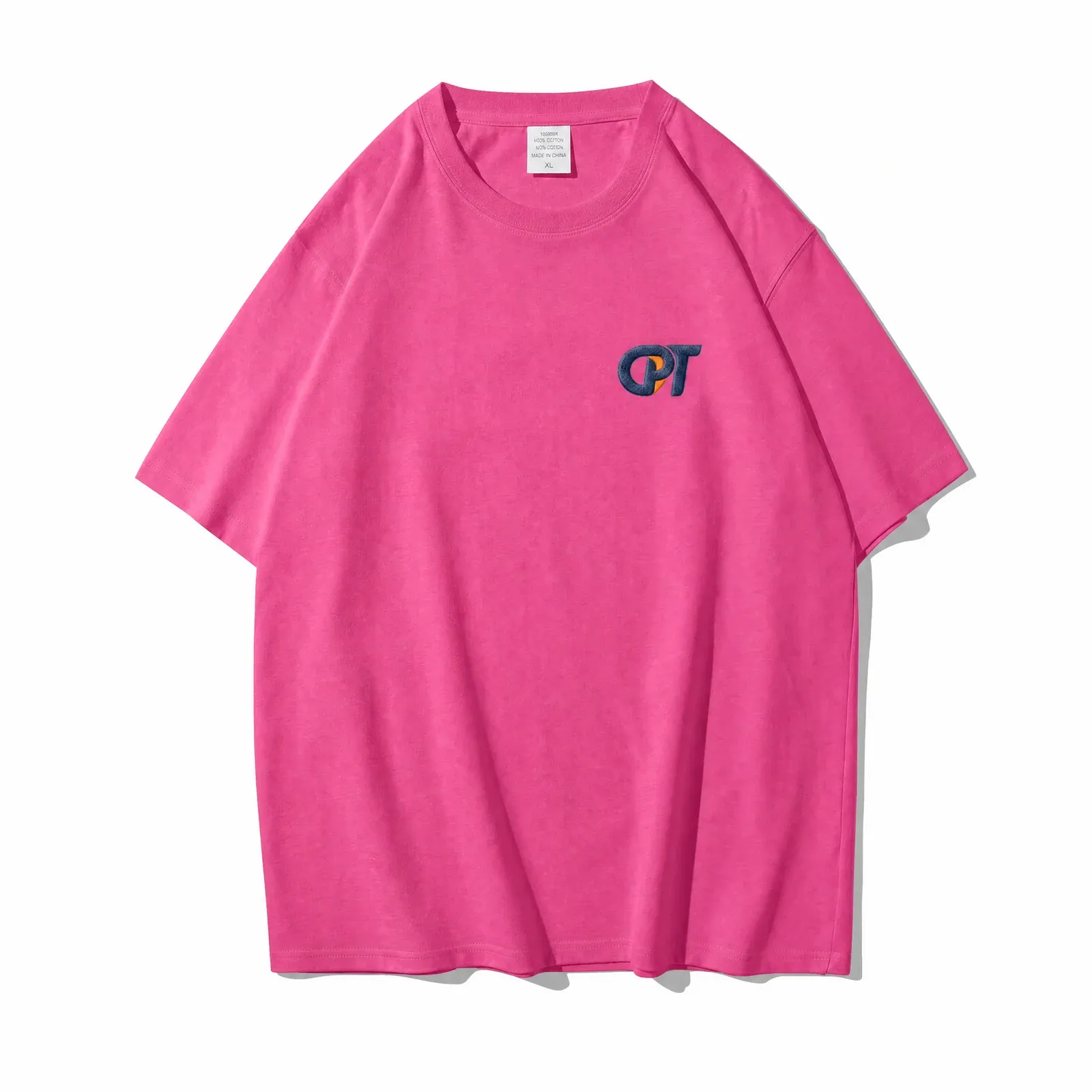 Pink drop shoulder t-shirt with embroidered chest logo, front view