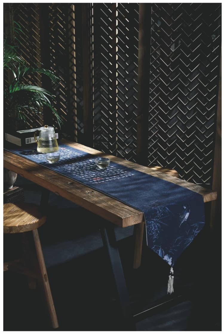 Blue crepe satin table runner on a dining table