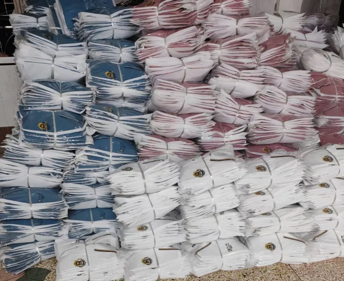 Packed shirts in white polybags with hangtags attached