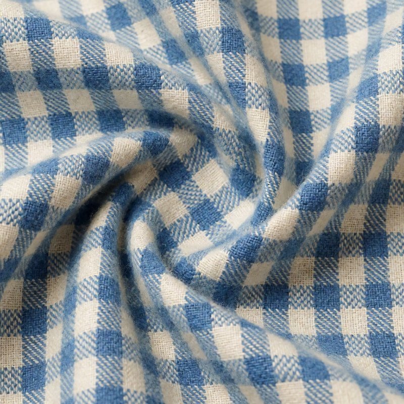 Macro of soft blue and cream check wool fabric