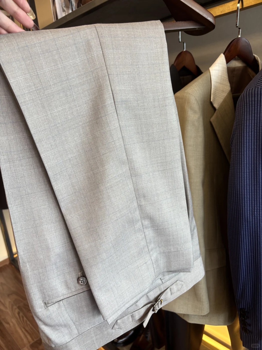 Gray suit trousers folded flat