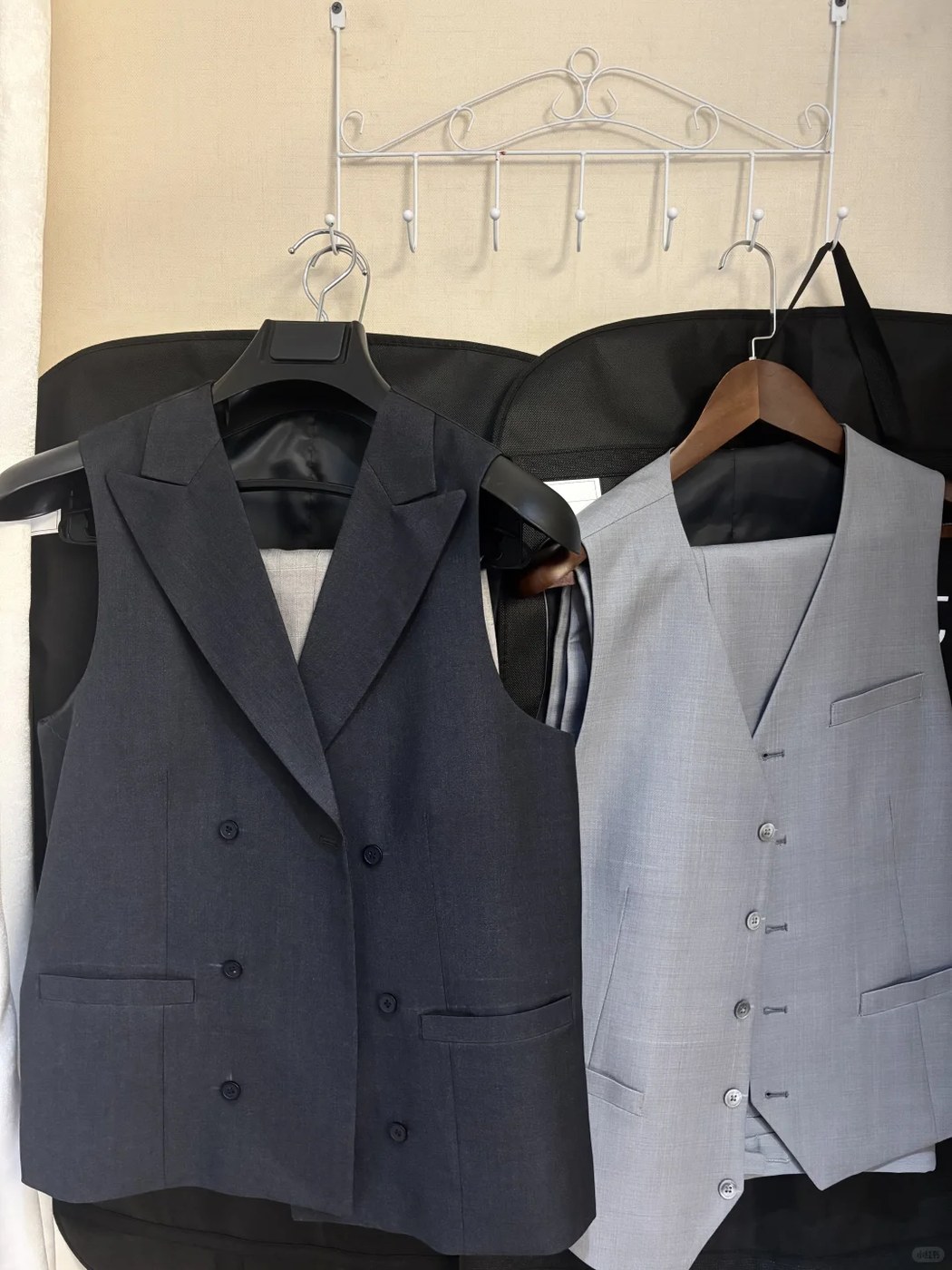 Navy and light blue waistcoats hanging