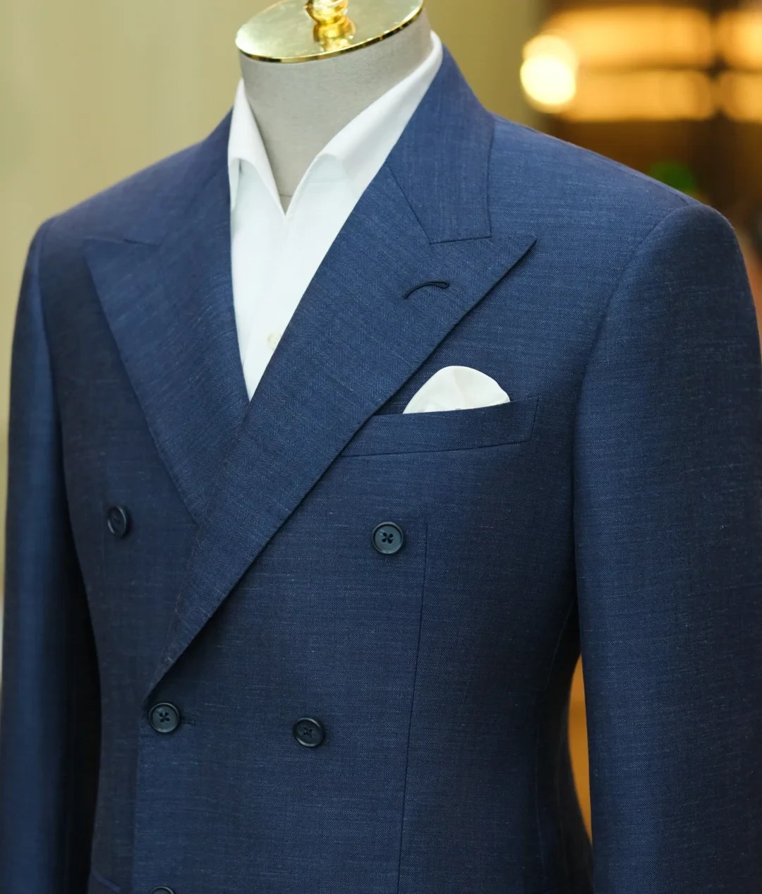 Navy double-breasted suit with white shirt and pocket square