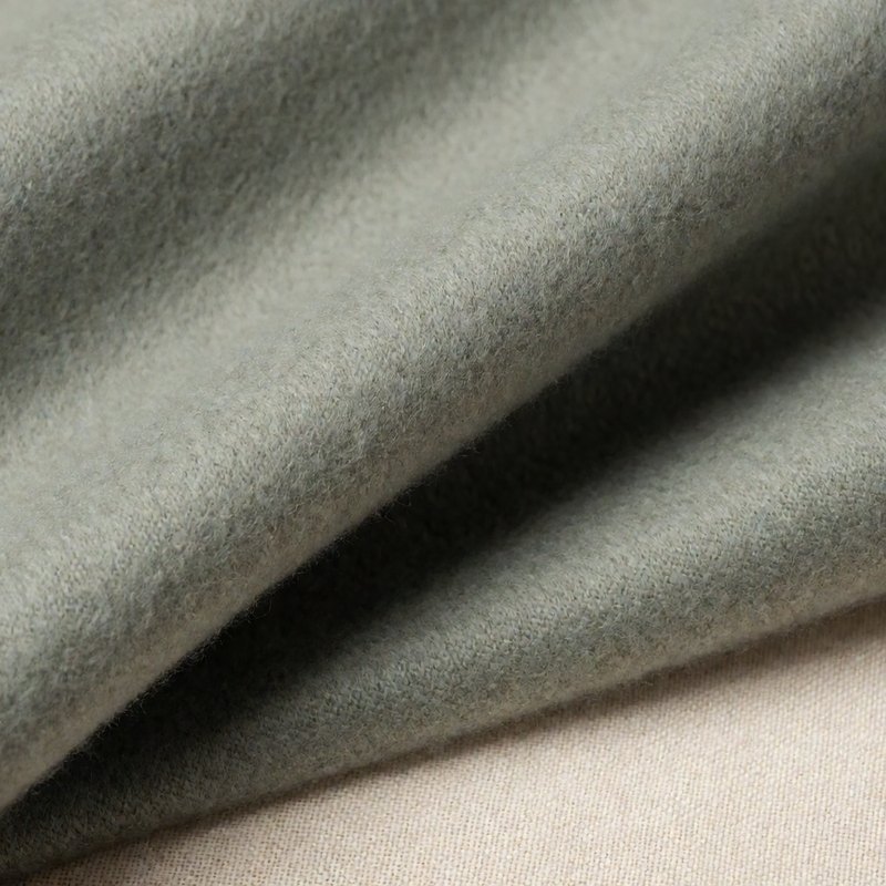 Macro of sage grey-green pure cashmere suiting fabric