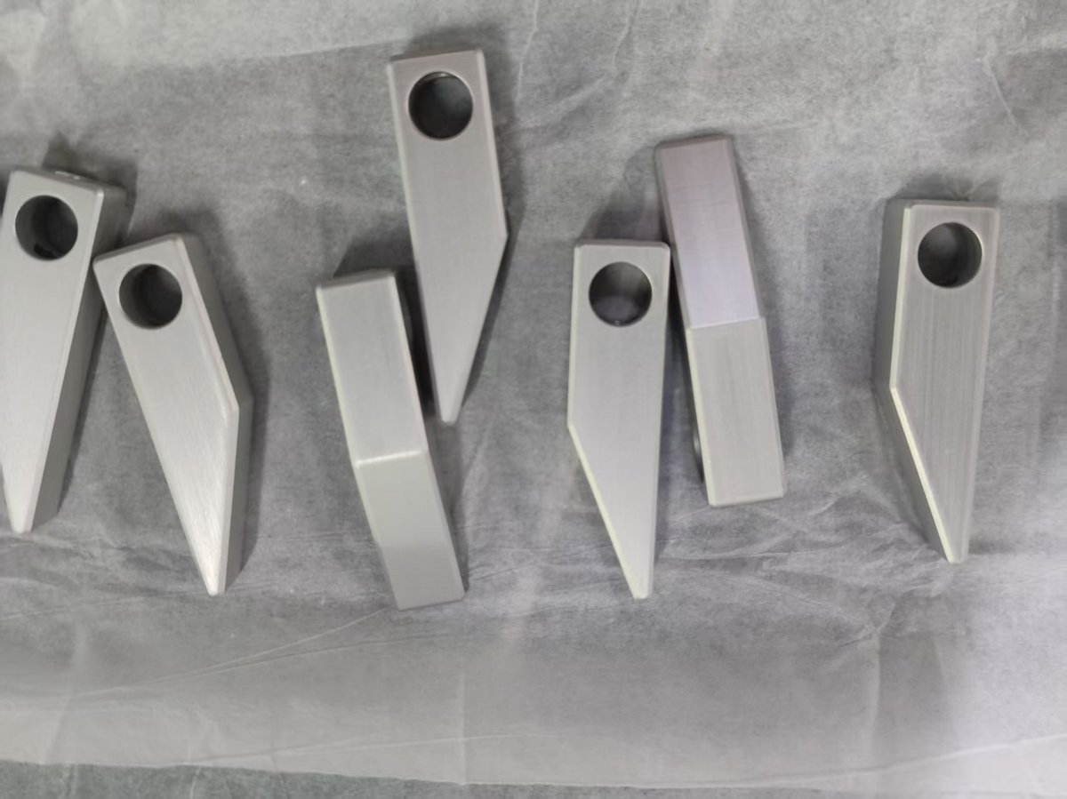 Batch of CNC machined aluminium gripper jaws with precision bores for automation grippers