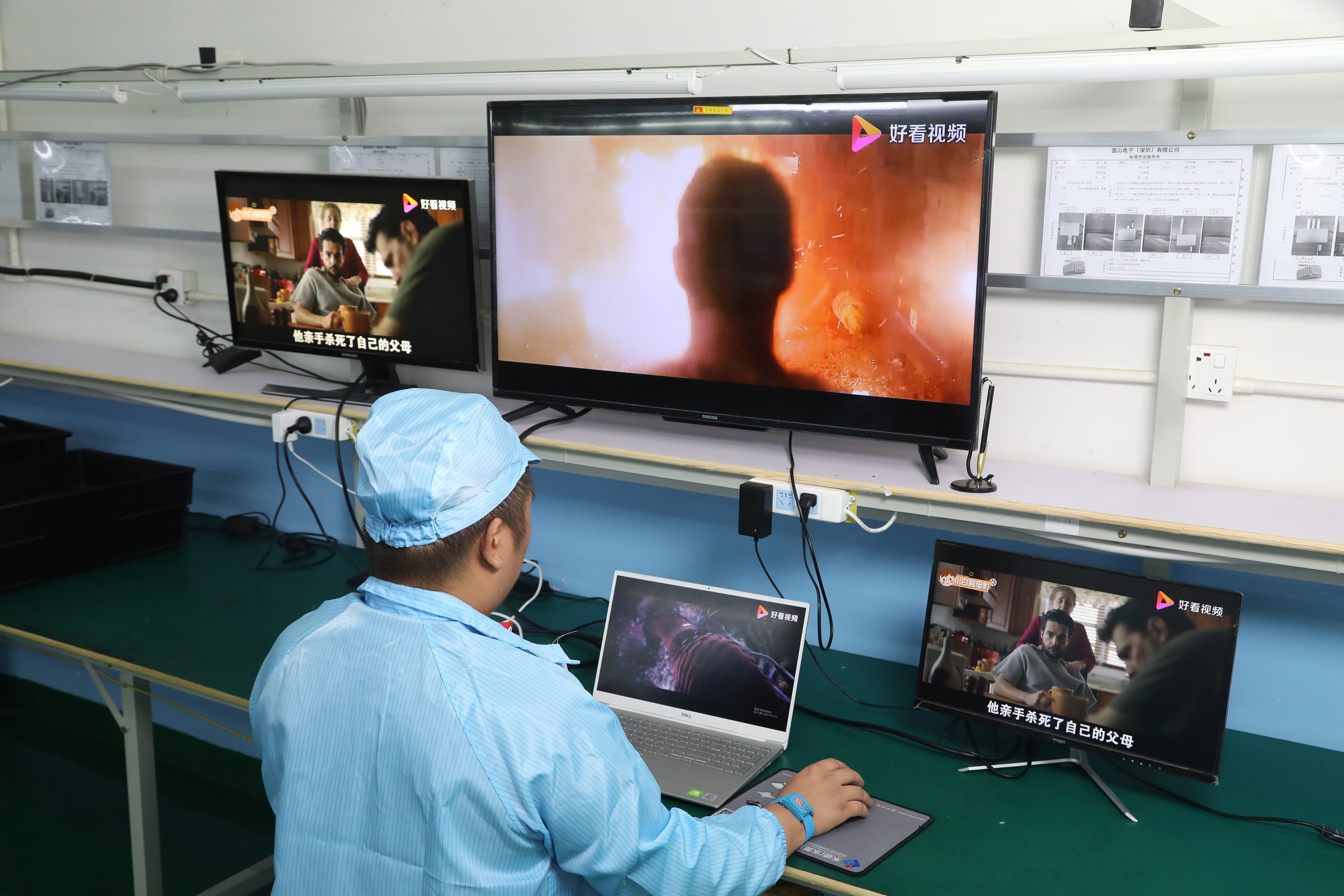Mattzon QC engineer testing dual-display output on production line