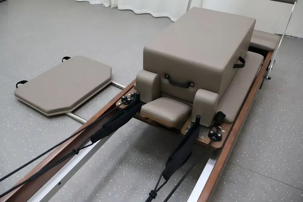 walnut-pilates-reformer-carriage-close-up.jpg