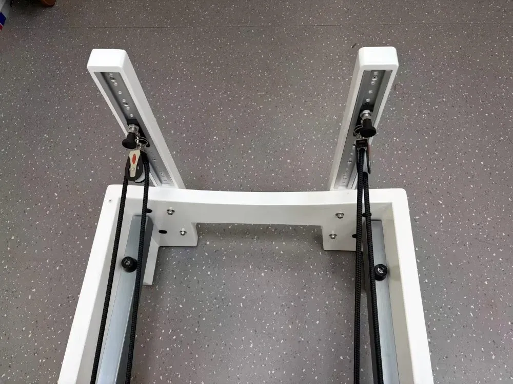white-painted-rubberwood-reformer-adjustable-pulley-system.jpg