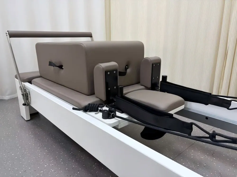 white-painted-rubberwood-reformer-carriage-shoulder-rests