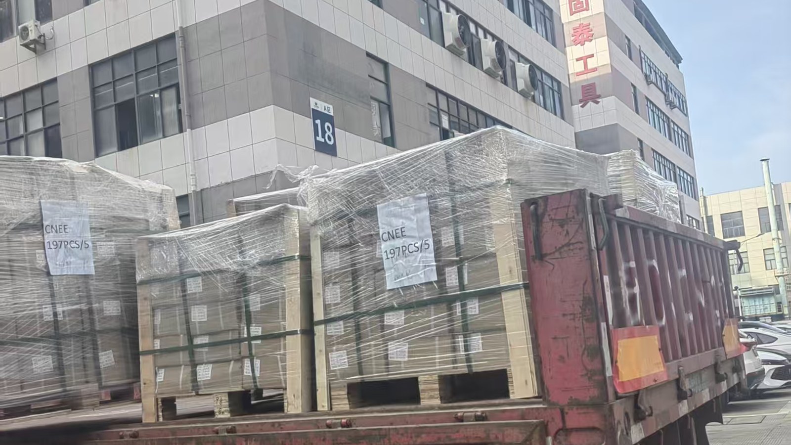 Wrapped export pallets loaded onto a truck outside the Shibao Brake factory in Yuhuan, Zhejiang, China