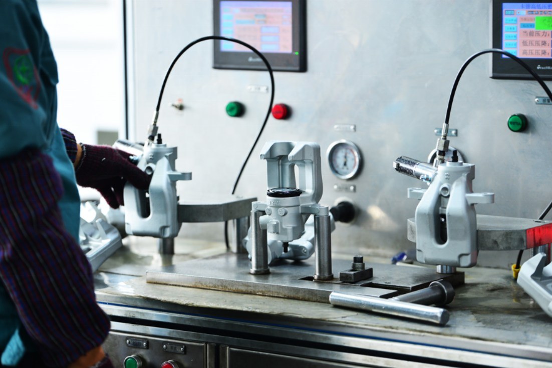 brake calipers on the leak testing bench at the Shibao Brake factory before shipment