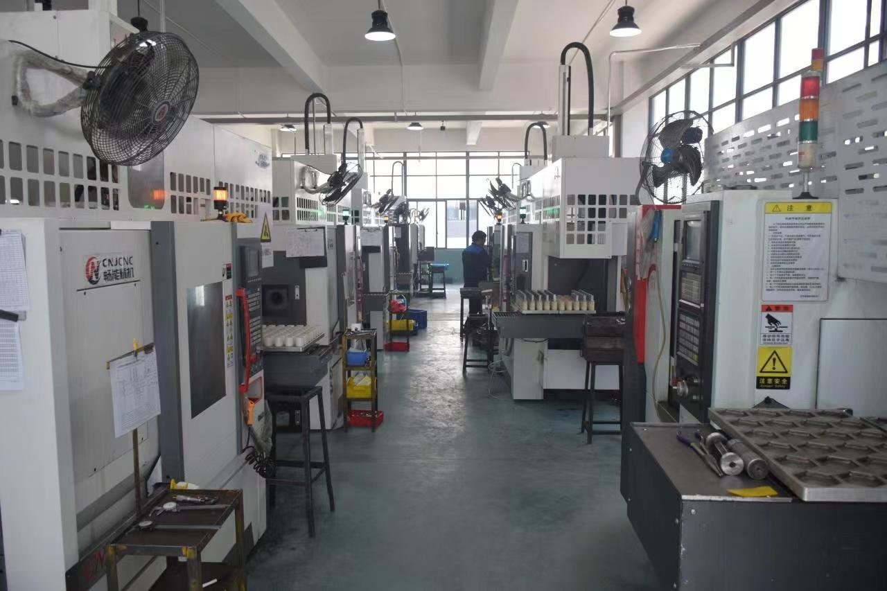 CNC machining workshop at the Yuhuan Shibao factory in Zhejiang, China