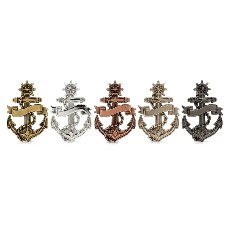 Five identical anchor-shaped challenge coins showing antique gold, silver, copper, nickel and black nickel platings