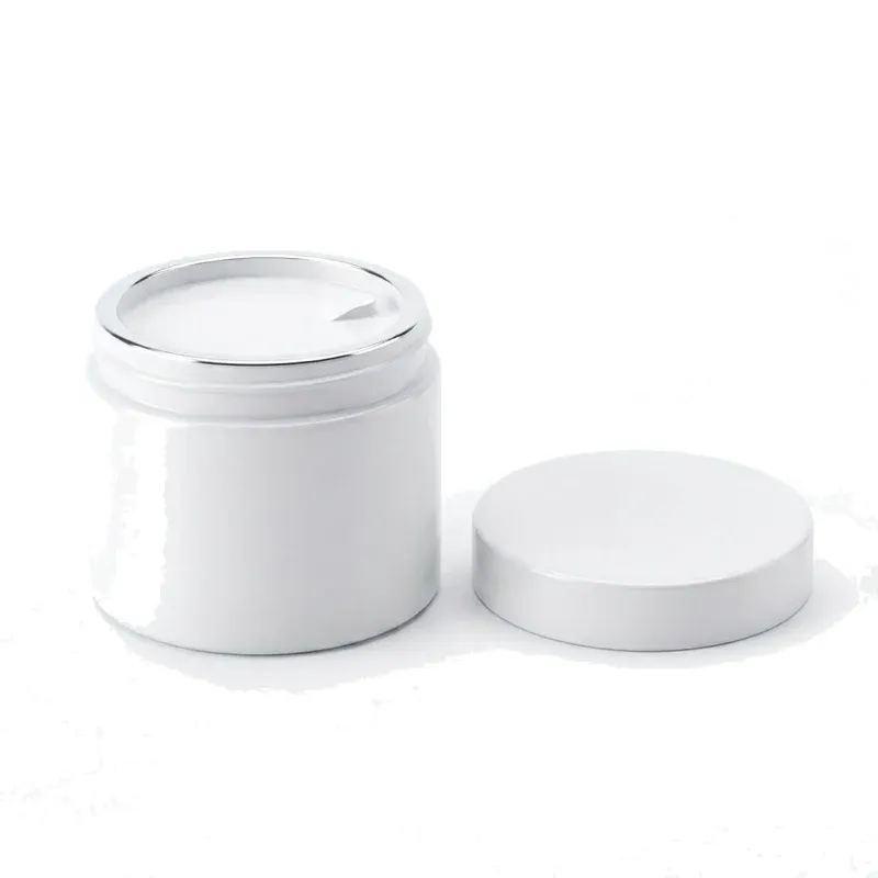 Open 300 ml mask jar showing wide mouth, silver mirror rim and white inner seal disc with pull tab, lid beside