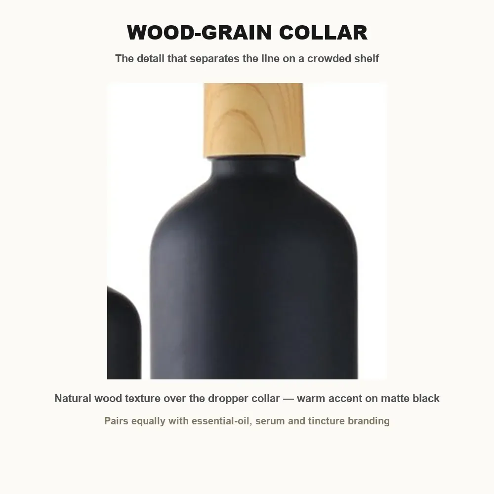 Natural wood-grain texture on the dropper collar of the matte black glass bottle