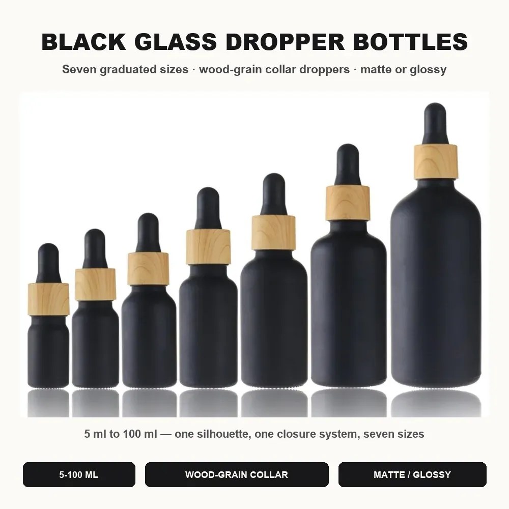 Black glass dropper bottles wholesale in seven graduated sizes from 5 ml to 100 ml with wood-grain collar droppers