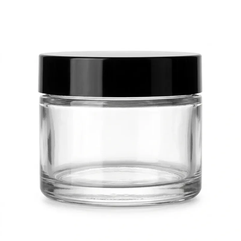 Clear glass cream jar with black screw cap