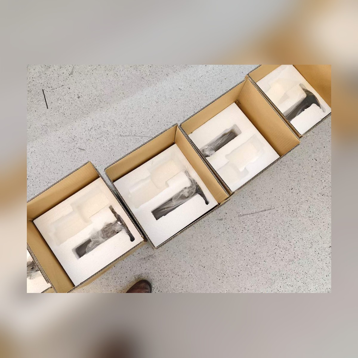 Foam packing detail - brass bell shade and curved stem protected for export shipping - NoorArch outdoor lighting