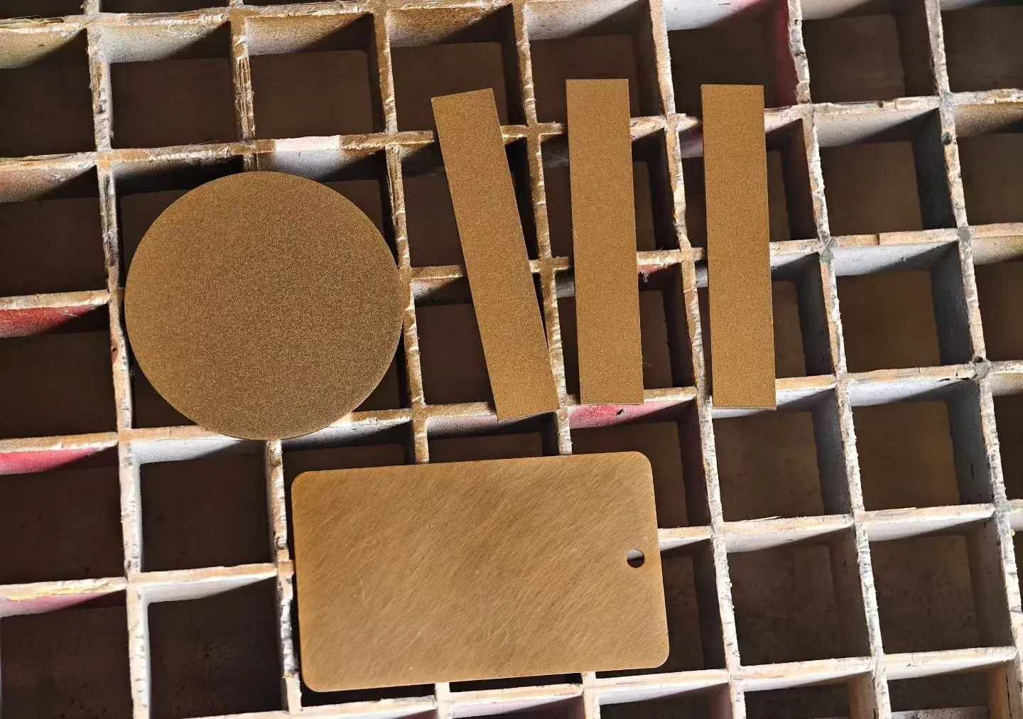Wooden crate holding brass garden light parts during export packing - NoorArch Lighting