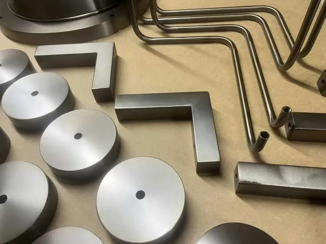 Brushed aluminium discs, bent tubes and machined brass parts for outdoor lights - NoorArch Lighting
