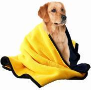 Dog wrapped in a microfiber pet drying towel