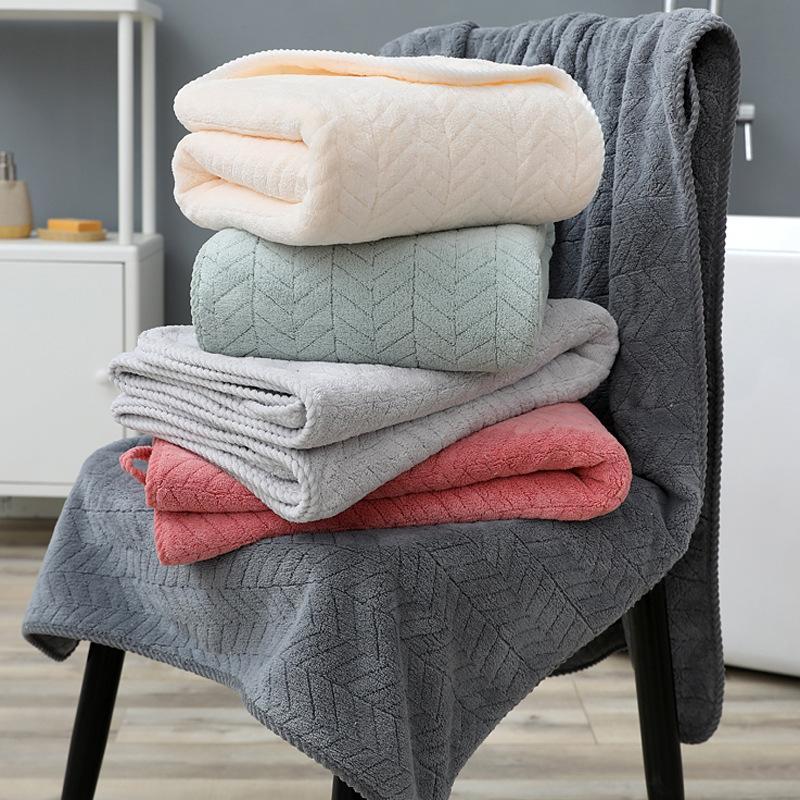 Folded microfiber towels in soft pastel colours