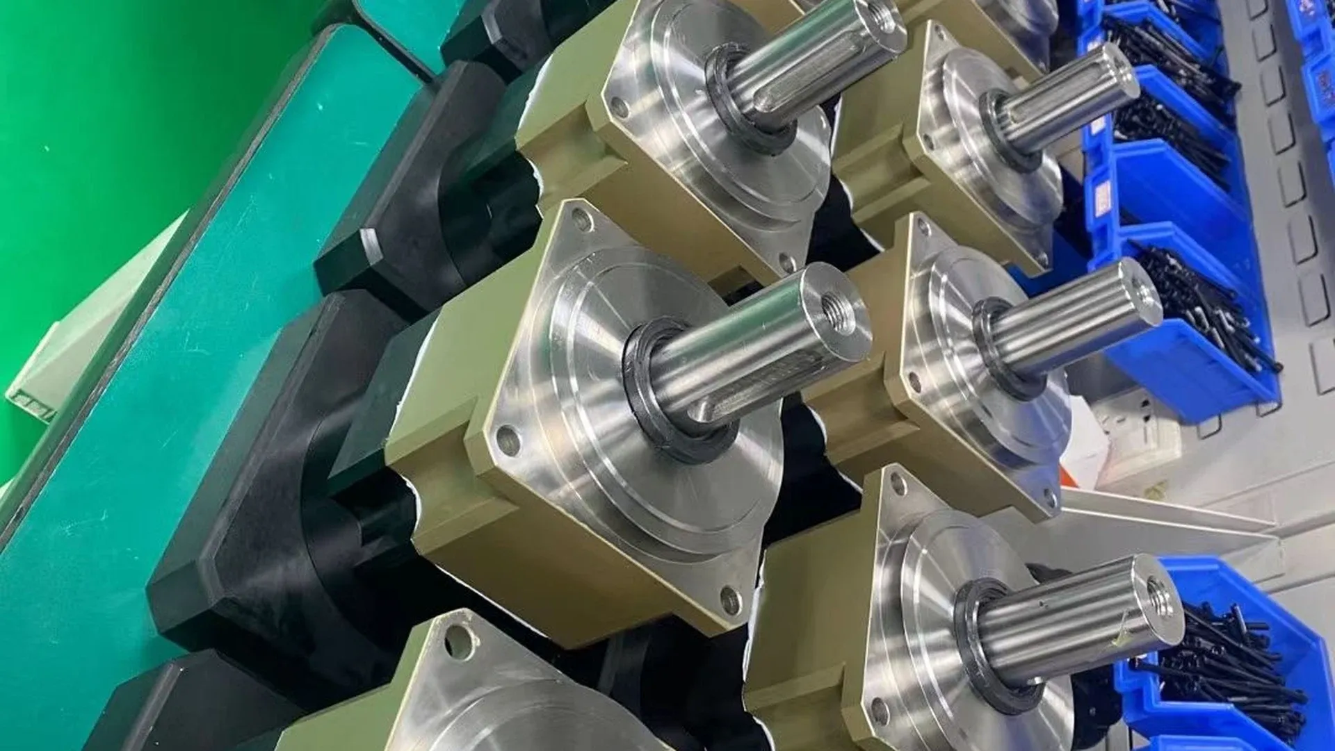 Planetary gearboxes with square output flanges lined up for dimensional inspection