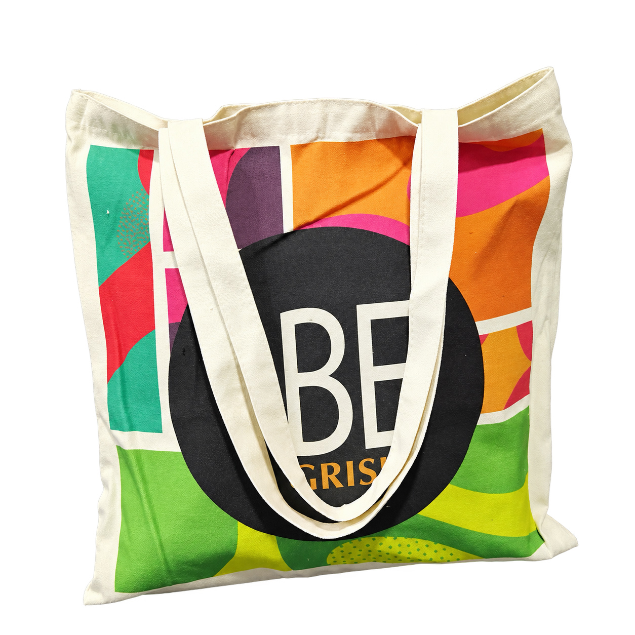 Natural canvas tote bag with colorful full-panel print and long shoulder handles