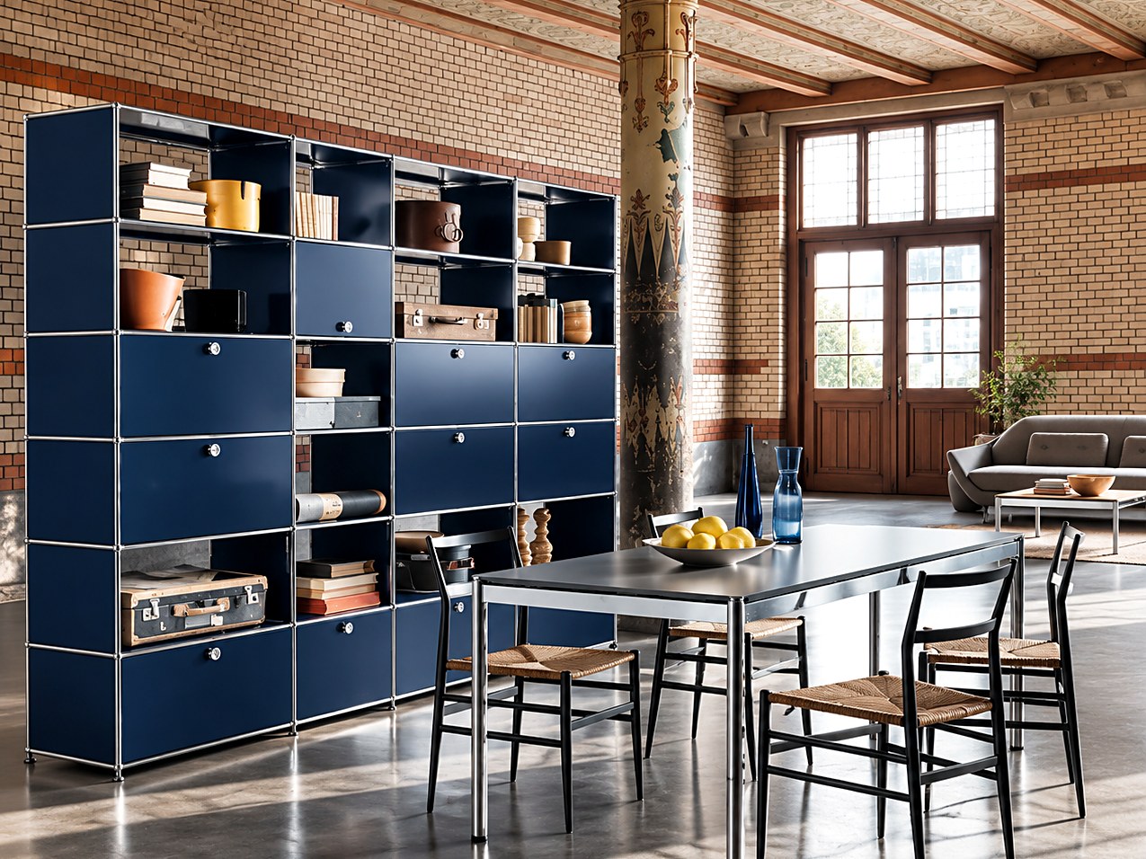Blue modular shelving and dining table in a loft interior