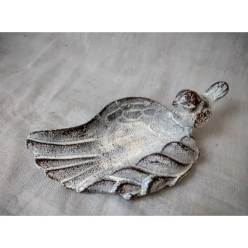 Distressed cast iron leaf tray with bird figurine
