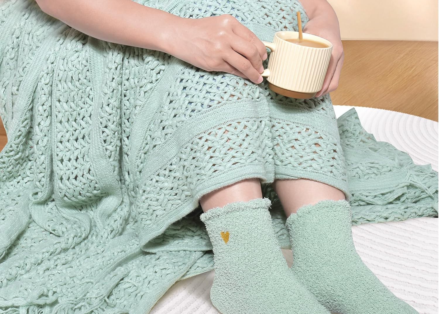 Cozy knitted socks and warm drink moment from sage self-care ritual box
